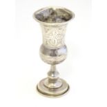 A silver Kiddush cup with engraved decoration, hallmarked London 1908, maker M.S. Approx. 3 1/2"