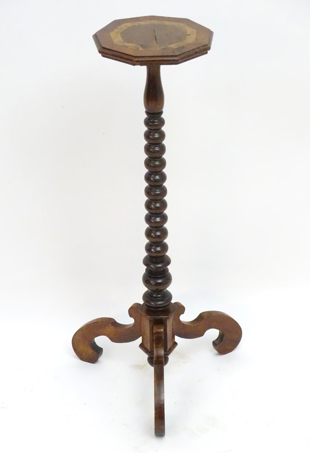 A 17thC and later walnut candle stand with a crossbanded top above a bobbin turned stem and three - Image 3 of 7