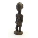 Ethnographic / Native / Tribal: A carved African figure. Approx. 1" high Please Note - we do not