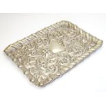 A silver tray with embossed acanthus scroll, Green Man and bird detail. Hallmarked Birmingham