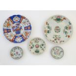 Five assorted Oriental plates to include famille rose plates with floral and foliate detail, each