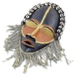Ethnographic / Native / Tribal: A painted African mask with shell detail. Approx. 11" long Please