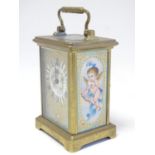 A French Carriage clock with hand painted porcelain panels. Approx 6" high Please Note - we do not