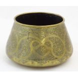 A 19thC Middle Eastern brass bowl / pot with engraved banded Islamic style calligraphy script and