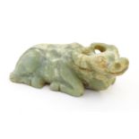 An Oriental carved hardstone model of a recumbent buffalo. Approx. 6" long Please Note - we do not