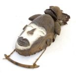 Ethnographic / Native / Tribal: A Nigerian mask with carved detail and white painted decoration.