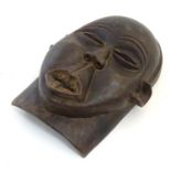 Ethnographic / Native / Tribal: A carved African mask. Approx. 12 1/2" long Please Note - we do