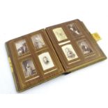 A late Victorian photograph leather bound photograph album containing a number of sepia portrait
