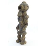 Ethnographic / Native / Tribal: A Nigerian carved figure with traces of blue paint. Approx. 21" high