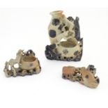Three Oriental carved soapstone brush washer pots, decorated with carved animals and foliage. The
