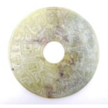 A Chinese carved soapstone bi disk / roundel. Approx. 7" diameter Please Note - we do not make