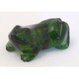 A late 20thC green jade coloured glass netsuke modelled as a frog. Approx. 1 3/4" long Please Note -