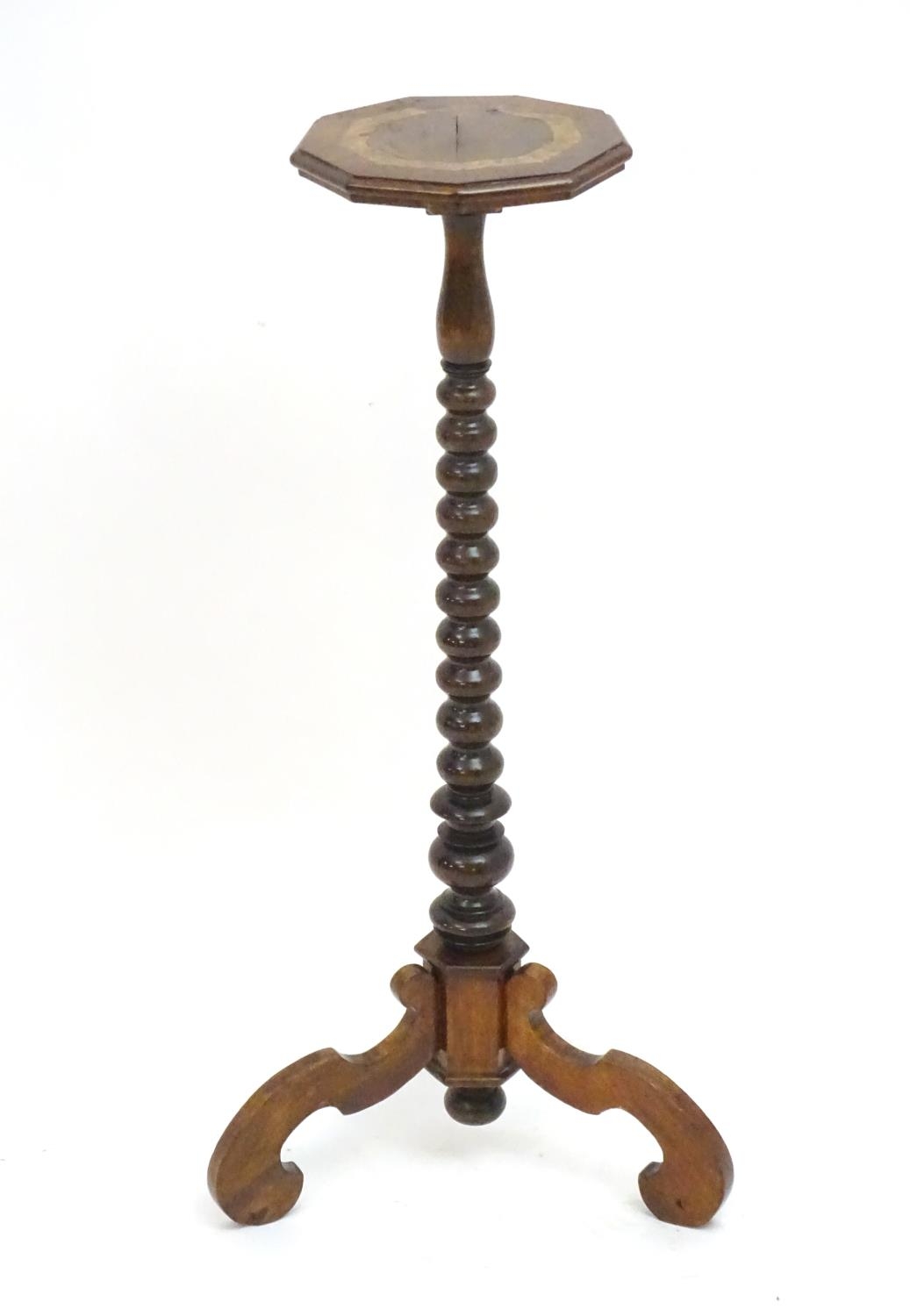 A 17thC and later walnut candle stand with a crossbanded top above a bobbin turned stem and three - Image 7 of 7