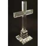 A glass cross on squared base. 10" high Please Note - we do not make reference to the condition of