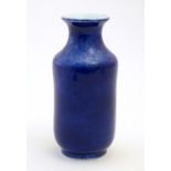 A Chinese vase with a flared rim with a cobalt blue ground. Approx. 7 3/4" high Please Note - we