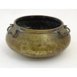 A 18th / 19thC Persian / Middle Eastern brass bowl with three handles with snake head detail, the