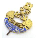 Militaria: a gilt and enamel car badge formed as the naval insignia of the Federation of Arab