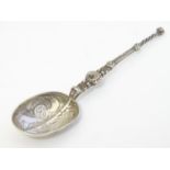 A silver teaspoon formed as an anointing spoon, hallmarked London 1901, maker Levi & Salamon.