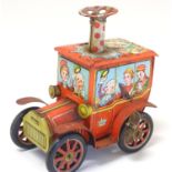 Toy: A Japanese novelty tin plate clockwork / wind-up toy Circus Car. Approx. 5 1/4" high Please