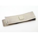 A silver money clip engraved ' Gucci ' to top. Approx 2" long Please Note - we do not make reference