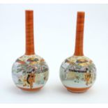 Two Japanese Kutani bottle vases decorated figures in a landscape scenes. Character marks under.