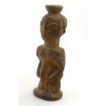 Ethnographic / Native / Tribal: A carved African figure. Approx. 11" high Please Note - we do not