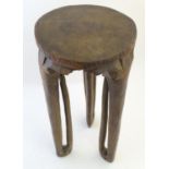 Ethnographic / Native / Tribal: An African stool with three legs. Approx. 21 1/2" high x 11"