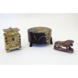 Three Oriental items comprising a soapstone model of a tiger, a circular pot and cover with gilt