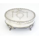 A silver dressing table / ring box of oval form with engraved decoration, hallmarked Birmingham