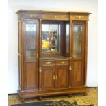 A mid 20thC continental mahogany cabinet having a recessed mirror back with grey marble top over two