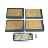 Toys: 20thC bamboo Mahjong tiles. Together with some bone gaming counters. The mahjong box approx. 3