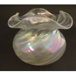 An Iridescent art glass glass bowl. Approx 4 1/4" high Please Note - we do not make reference to the