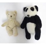 Toys: Two 20thC bears, comprising a panda bear with button jointed limbs, and a straw filled teddy