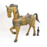 Toy: A Continental carved wooden model of a horse with polychrome decoration. Possibly a