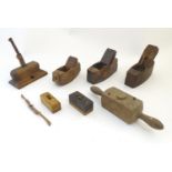 An assortment of early 20thC woodworking tools comprising coffin planes, spoke shave etc (8)