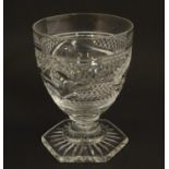 A cut glass rummer / drinking glass on hexagonal foot. Approx 5 1/4" high Please Note - we do not