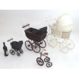Toys: Three 20thC hooded dolls prams, two with wickerwork frames. Together with a model of a penny