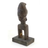 Ethnographic / Native / Tribal: A carved African Heddle Pully with figural detail. Approx. 7 1/4"
