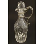 A Victorian cut glass oil bottle with silver handle and mounts Hallmarked London 1879 maker