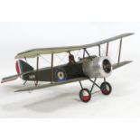 Toy: A 20thC scale model of a Sopwith Camel aeroplane / bi plane with removable pilot and polychrome
