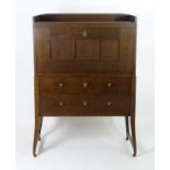 A late 19thC / early 20thC oak cabinet in the manner of Richard Riemerschmid, with a tapering