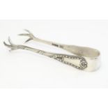 A pair of silver sugar nips with bird claw formed grips, hallmarked Sheffield 1922, maker Robert