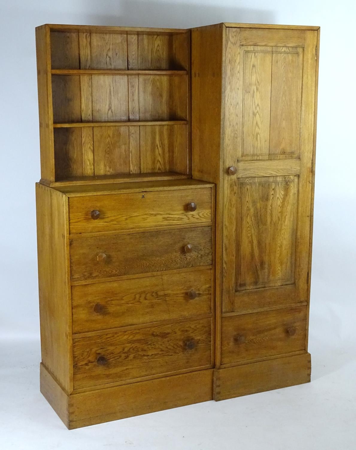 An early / mid 20thC oak combination wardrobe to a design by Peter Waals, Loughborough University.