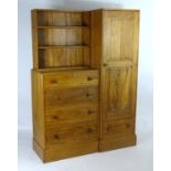 An early / mid 20thC oak combination wardrobe to a design by Peter Waals, Loughborough University.