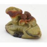 A Chinese soapstone carving modelled as a monkey on the back of a seated water buffalo. Approx. 3"