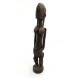 Ethnographic / Native / Tribal: A carved Dogon figure. Approx. 25" high Please Note - we do not make
