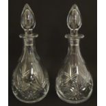 Two cut glass decanters, one marked under Thos Webb England. Each approx 12" high overall (2) Please