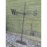A 19thC cast iron weathervane, the compass points with Victorian spur lettering, approximately 58"