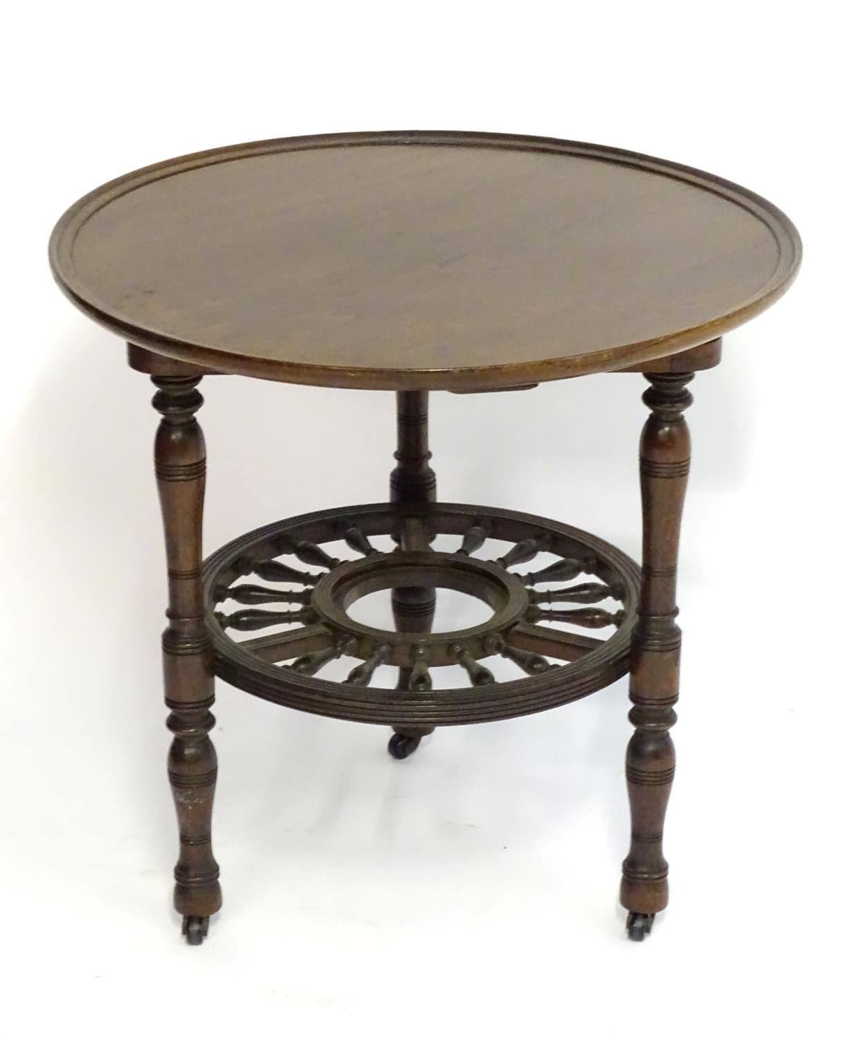 A late 19thC mahogany occasional table with a lazy Susan top and rounded under tier with turned - Image 4 of 8