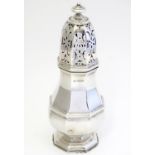 A silver caster / shaker hallmarked Birmingham 1915 maker S W Smith & Co 7 1/2" high Please Note -